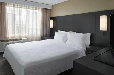 a hotel room with a large bed and a window at Residence Inn by Marriott London Canada in London