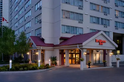 a hotel with a sign on the front of a building at Residence Inn by Marriott London Canada in London
