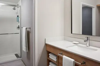 a bathroom with a sink and a mirror at Residence Inn by Marriott Mississauga-Airport Corporate Centre West in Mississauga