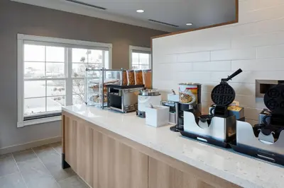 a kitchen with a counter top with some food at Residence Inn by Marriott Mississauga-Airport Corporate Centre West in Mississauga