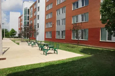 a row of benches in front of a building at Residence & Conference Centre - Brampton in Brampton