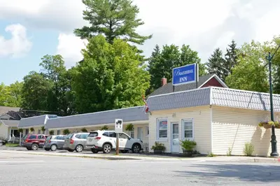 a mobil gas station with cars parked in front of it at Bracebridge Inn in Bracebridge