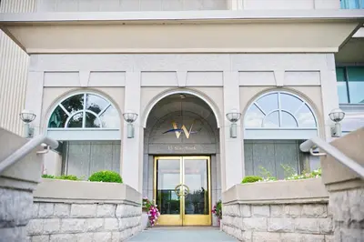 a entrance to a building with a gold door at The Waterside Inn in Mississauga