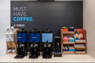 a group of bottles of coffee on a table at Holiday Inn Express Toronto Downtown by IHG in Toronto