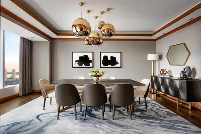 a dining room with a table and chairs at The Ritz-Carlton, Toronto in Toronto