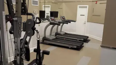 a row of cardio machines in a gym at BEST LOCATION/SPECTACULAR VIEW 2 BEDROOMS FURNISHED CONDO S/L RENT in Mississauga