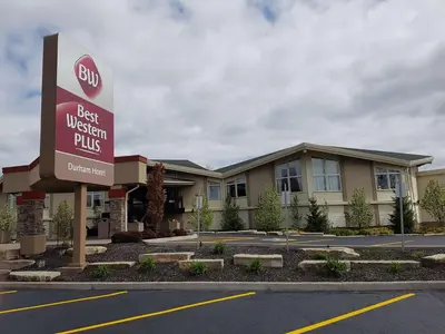 a sign in front of a best western plus hotel at Best Western Plus Durham Hotel & Conference Centre in Oshawa