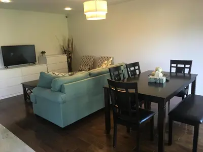 a living room with a couch and a table at Home Base in Markham