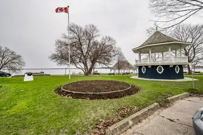 a park with a gazebo in the grass at Maples Motel in Orillia