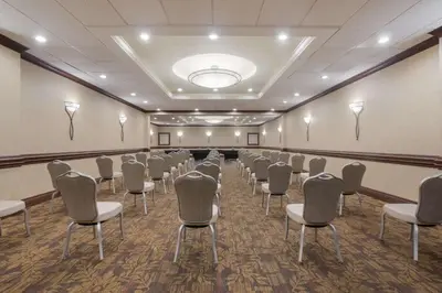 a conference room with rows of chairs in it at Best Western St Catharines Hotel & Conference Centre in St. Catharines