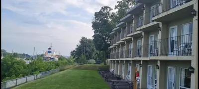 a row of chairs sitting on the side of a building at The Inn At Lock Seven in Thorold