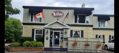a inn with a sign on the front of it at The Inn At Lock Seven in Thorold