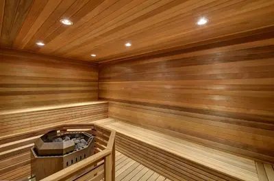 a sauna with wooden walls and wooden flooring at Queens Landing in Niagara on the Lake