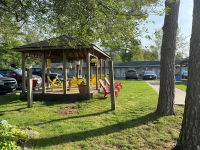a playground with a gazebo in a park at Wasaga Beach Inn And Cottages in Wasaga Beach