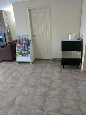 a room with a door and a tiled floor at Luxury Inn in Collingwood