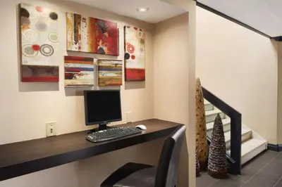 a computer sitting on a desk in a room at Days Inn by Wyndham Brantford in Brantford