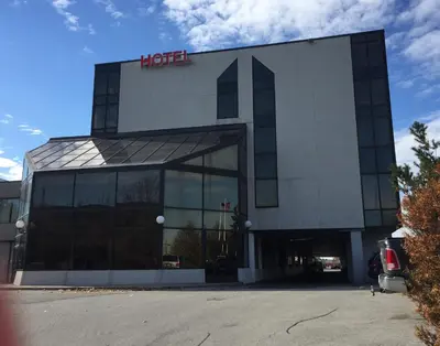 a hotel building with a hilton sign on it at Montecassino Hotel & Event Centre in Toronto