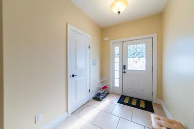 a hallway with a white door and a window at HB Guest Home 4 in Waterloo