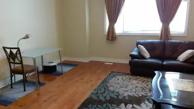 a living room with a couch and a table at HB Guest Home 4 in Waterloo