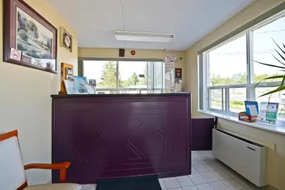a large purple door in a waiting room at Angus Inn Motel in Angus