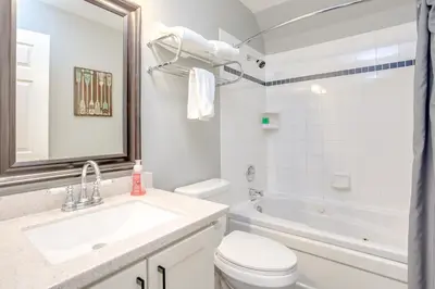 a bathroom with a sink and a toilet and a tub at Blue Mountain Studio Loft at North Creek Resort in Blue Mountains
