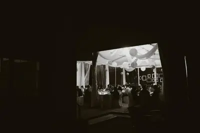 a black and white photo of a group of people at a wedding at Timber House Resort in Brighton