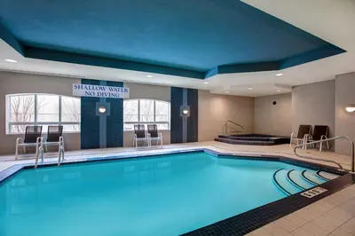 a large swimming pool in a hotel room at Days Inn & Suites by Wyndham Collingwood in Collingwood