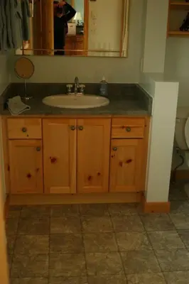 a bathroom with a sink and a mirror at Sunny Rock Bed & Breakfast in Minden