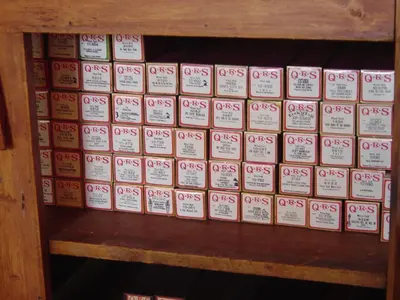 a bunch of books sitting on top of a shelf at Sunny Rock Bed & Breakfast in Minden