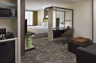 a hotel room with a bed and a desk at SpringHill Suites by Marriott Toronto Vaughan in Vaughan