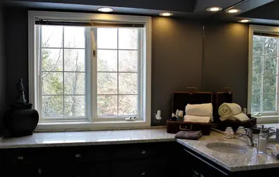 a bathroom with a sink and a large mirror at Tailwinds B&B in Erin