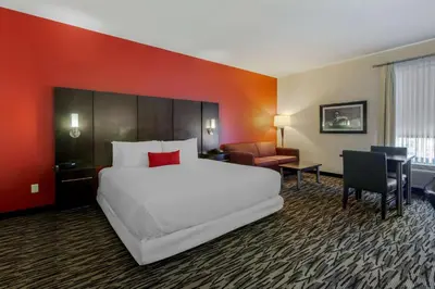 a large white bed in a hotel room at C Hotel by Carmen's, BW Premier Collection in Hamilton