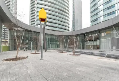 a parking meter in front of a building at Executive Corner Suite with Panoramic View in Toronto