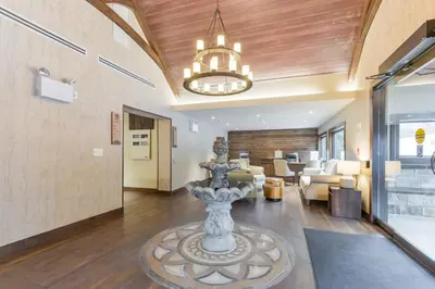 a lobby with a fountain in the middle of a room at Northumberland Heights Wellness Retreat & Spa in Cobourg