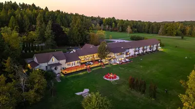 an aerial view of a large house with a lawn at Northumberland Heights Wellness Retreat & Spa in Cobourg