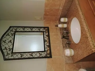 a bathroom with a mirror and a sink at Bradford Vacation in Bradford