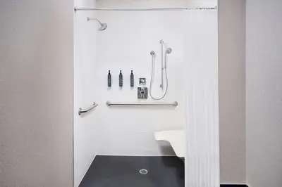 a bathroom with a shower and a sink at Aloft Vaughan Mills in Vaughan