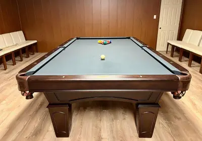 a pool table with a ball on top of it at Fullerton Manor Inn in Niagara Falls