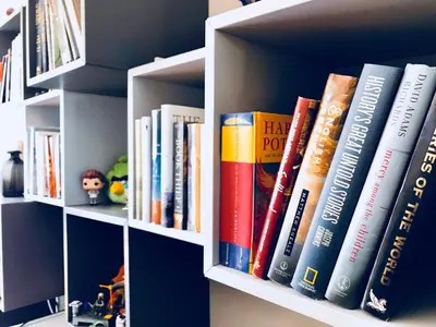 a book shelf filled with lots of books at Home in Downtown in Toronto