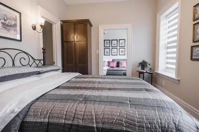 a bedroom with a bed and a window at Evanndor in Stratford