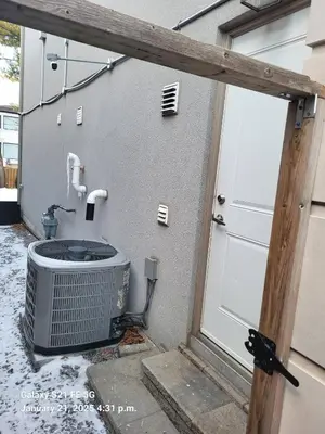 an outside view of a building with a heater and a door at Hillcrest Modern House in Toronto