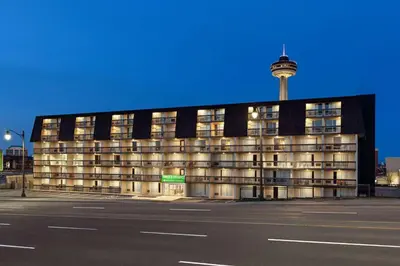 a building with a tower on top of it at Wyndham Garden Niagara Falls Fallsview in Niagara Falls