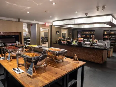 a restaurant with several trays of food on a table at Hockley Valley Resort in Orangeville