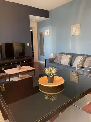 a living room with a couch and a table at Stylish Condos Toronto in Toronto