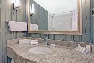 a bathroom with a sink and a mirror and towels at Hilton Garden Inn Toronto/Markham in Thornhill