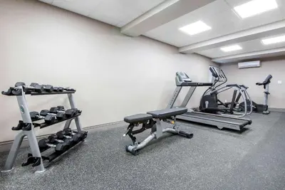 a gym with two treadms and two machines at The Champlain Waterfront Hotel, an Ascend Collection Hotel in Orillia