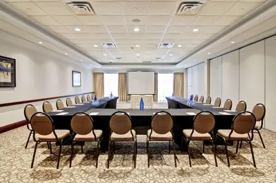 a conference room with a large table and chairs at Hilton Garden Inn Toronto/Burlington in Burlington