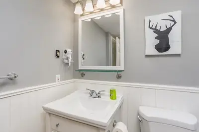 a white bathroom with a sink and a mirror at Blue Mountain Getaway at North Creek Resort King Bed in Blue Mountains