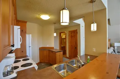 a kitchen with a sink and a counter top at The Blue Escape Blue Mountain Chalet in Blue Mountains