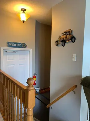 a hallway with a door with a car on the wall at Evening Shade in Fergus